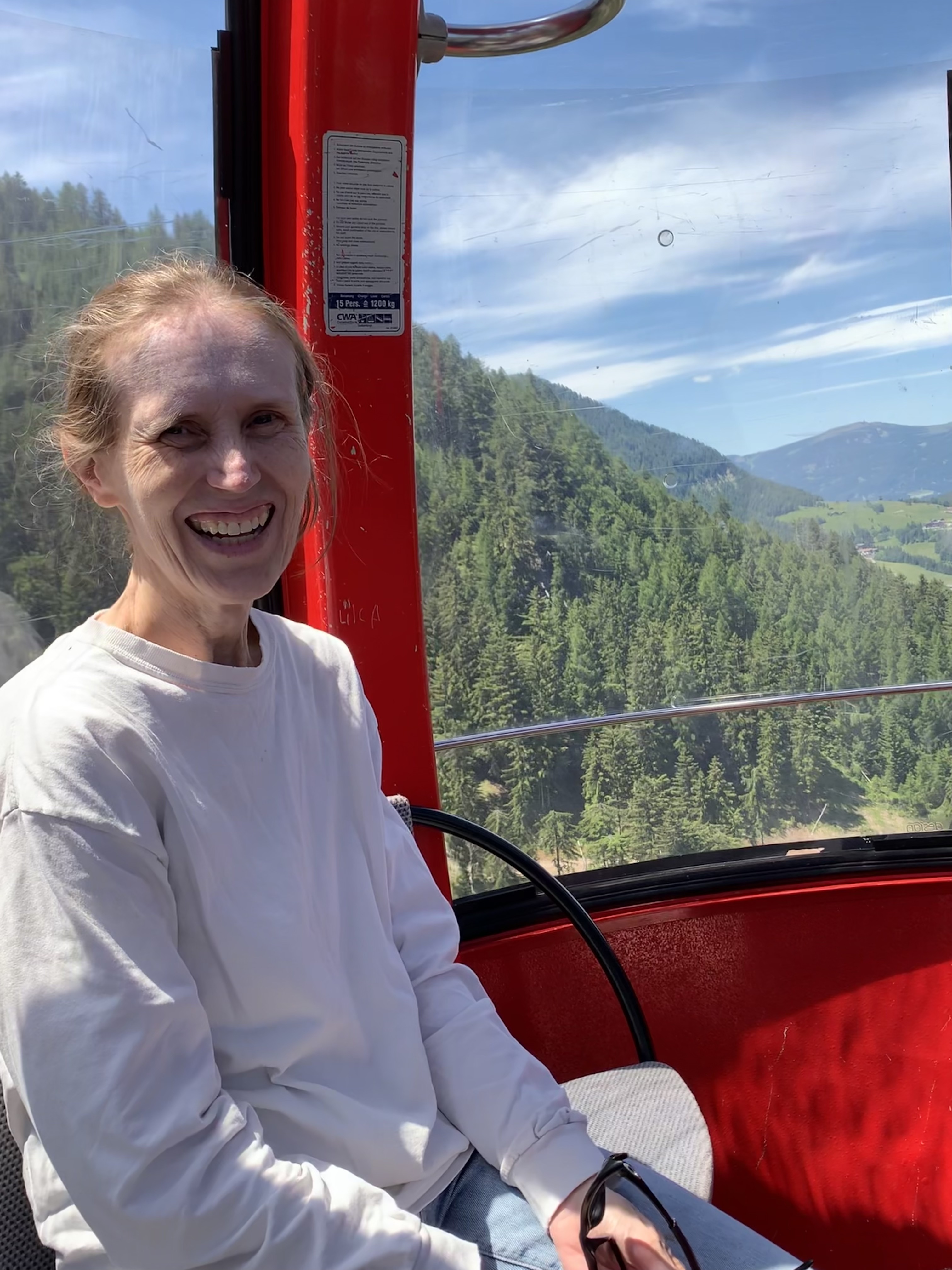 woman smiling in a chairlift